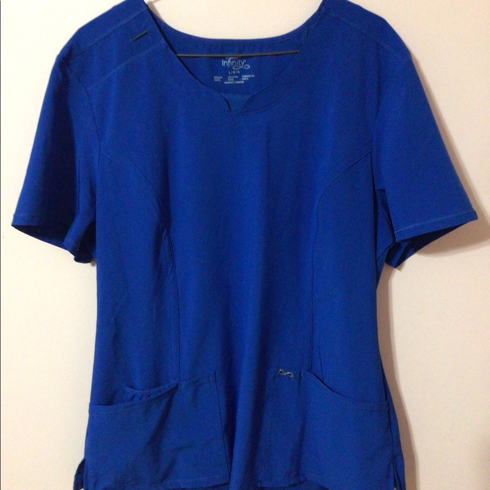 Cherokee scrub top, royal blue, women’s size large.